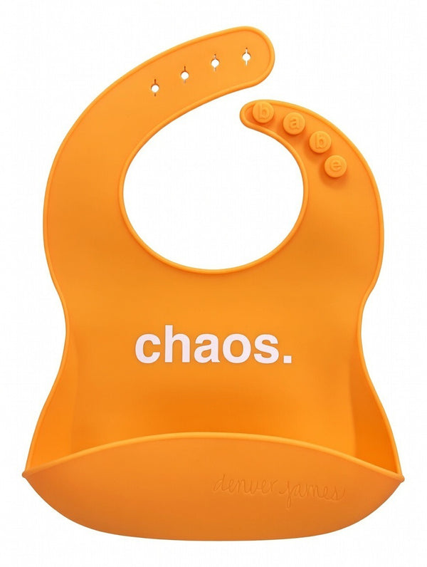 Front View of a bright orange silicone food catcher bib with 'chaos.' text on a white background.
