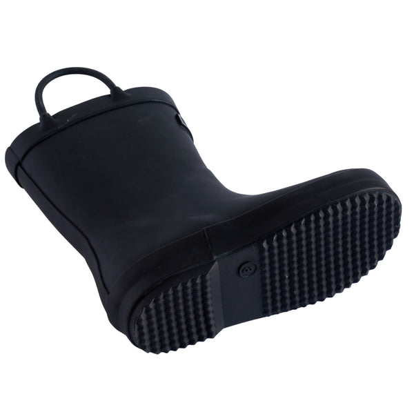 Detail image of black rubber children's rain boot with a textured sole on a white background with pull handles.