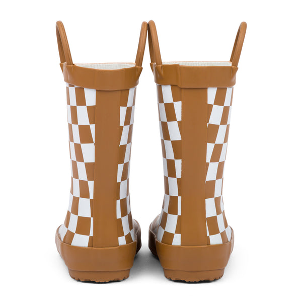 Back view of chocolate and white checkered children's rain boots on a white background.