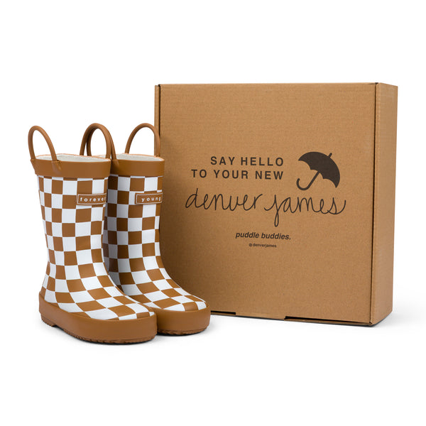 Chocolate and white checkered rain boots with a cardboard box branded with 'Denver James' on a white background.