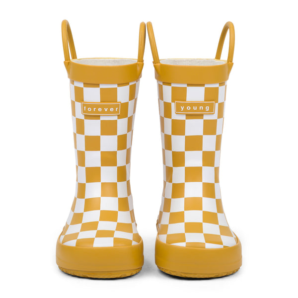 Front view of golden and white checkered children's rain boots with 'forever young' branding on a white background.