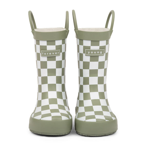Front view of green and white checkered children's rain boots with 'forever young' branding and grip handles for easy slip on, on a white background.