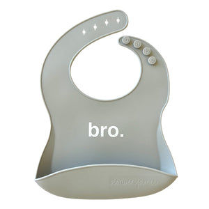 Front View of a green silicone food catcher bib with 'bro.' text on a white background.