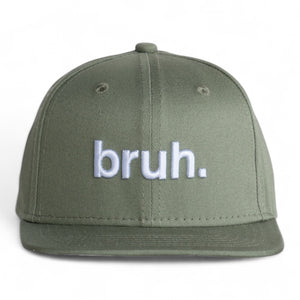 Front view of a  green 6 panel classic ball cap with the word 'bruh.' embroidered on the front.