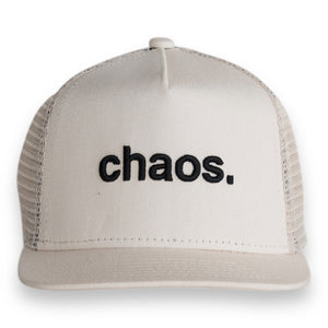 White trucker cap with 'chaos.' text on a white background