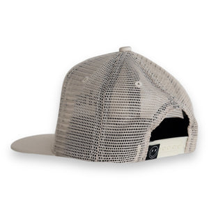 Toddler snapback hat with smiley face tag on white background. 