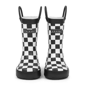 Front view of Black and white checkered children's rain boots with 'forever young' branding on a white background