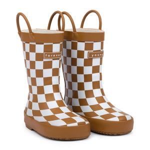 Front 3/4 view of chocolate and white checkered children's rain boots with 'forever young' branding on a white background.