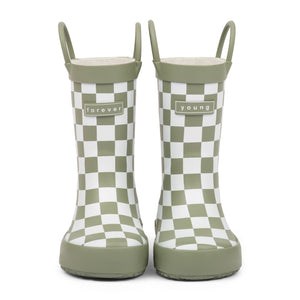 Front view of green and white checkered children's rain boots with 'forever young' branding and grip handles for easy slip on, on a white background.