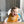 lifestyle image of baby boy wearing a silicone food catcher bib at a table with white text that says 'happy hour.'
