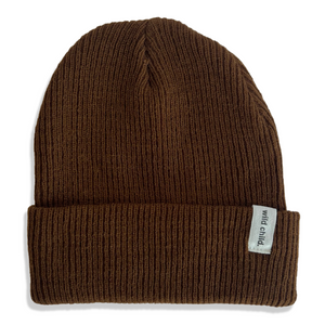 Dark brown kids beanie on a white background with  a 'wild child' label. 