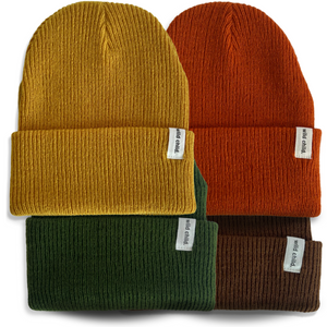 Four knit beanie hats in yellow, orange, green, and brown with labels on a white background.