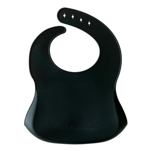 Back view of a black silicone bib on a white background with '#denverjamesbabe' text.