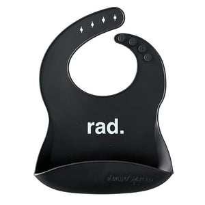 Front View of a black silicone food catcher bib with white 'rad.' text on a white background.