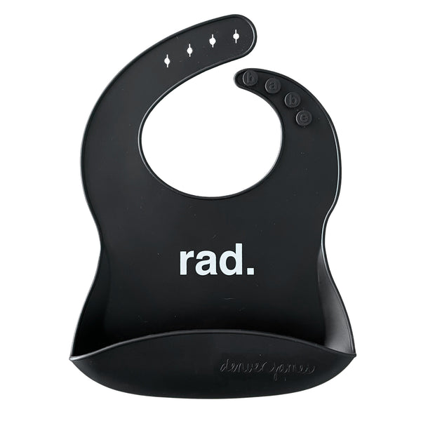 Front View of a black silicone food catcher bib with white 'rad.' text on a white background.