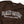 Detail view of a Brown sweatshirt with 'RAD MOM BUILT FOR CHAOS' text on a white background