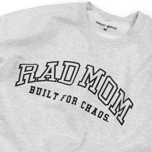 Detail of a Gray sweatshirt with 'RAD MOM BUILT FOR CHAOS' text on a white background