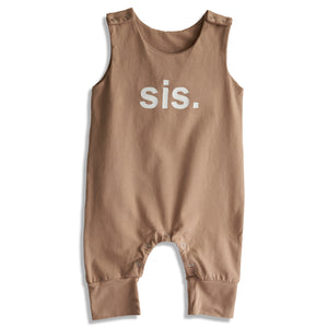 Brown baby romper with 'sis.' text on a white background