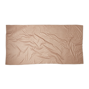 an overhead shot of the back of a beige microfiber beach towel showing the texture of the fabric and the rectangular dimensions of the towel. there is nothing printed on the back, it is a solid color.