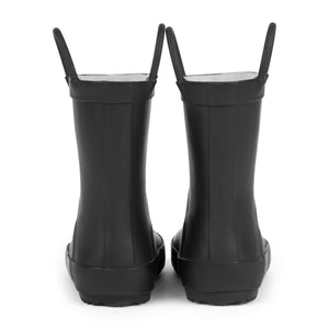 Front view of a pair of black colored rain boots for children. Showing pull handles for easy slip on and tags that say "Forever Young" on the front. 