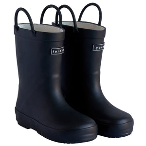 Front 3/4 view of a pair of black colored rain boots for children. Showing pull handles for easy slip on and tags that say "Forever Young" on the front. 