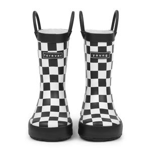 Front view of Black and white checkered children's rain boots with 'forever young' branding on a white background