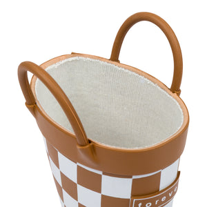Detail view of chocolate and white checkered children's rain boots with with pull handles for easy slip on and soft lining on a white background. 