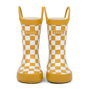 Front view of golden and white checkered children's rain boots with 'forever young' branding on a white background.