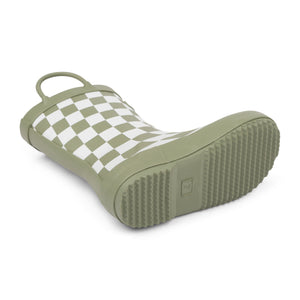 Detail image of green and white checkered colored children's rain boot focusing on the sole with texture and size stamped into the bottom on a white background. 