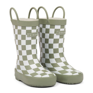 Front 3/4 view of green and white checkered children's rain boots with 'forever young' branding and grip handles for easy slip on, on a white background.