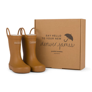 Chocolate checkered rain boots with a cardboard box branded with 'Denver James' on a white background. 