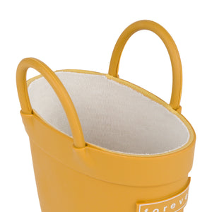 Detail view of Golden colored children's rain boots with with pull handles for easy slip on and soft lining on a white background. 