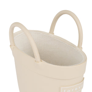 Detail view of Sand colored children's rain boots with with pull handles for easy slip on and soft lining on a white background. 