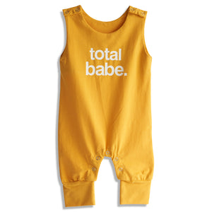 Yellow romper with 'total babe.' text on a white background