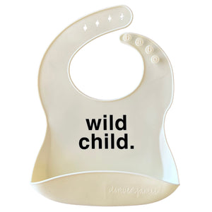 Front View of a white silicone food catcher bib with black 'wild child.' text on a white background.