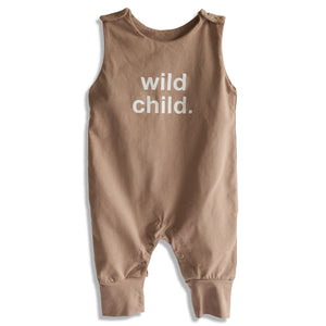 A tan baby romper with the text 'wild child.' printed on the front.