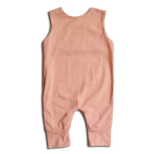 Back view of pink baby romper on a white background. 