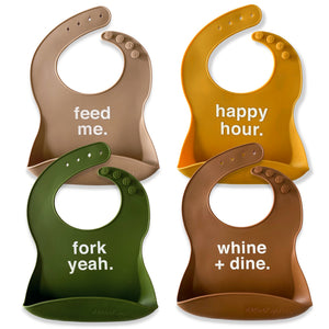 Four colorful bibs with humorous text on a white background
