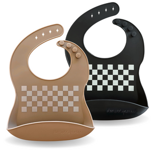 Two baby bibs, one brown with checkered pattern and one black with checkered pattern, on a white background.