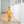 little girl standing in a hallway with wood floors wearing a baby romper that says 'total babe.'